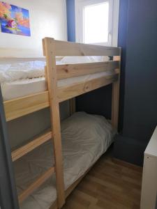 a couple of bunk beds in a room at Charmant appartement vue mer au Cap d'Agde in Cap d'Agde
