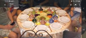 a table with plates and utensils on top at Riad Dar Pa Labzioui in Meknès