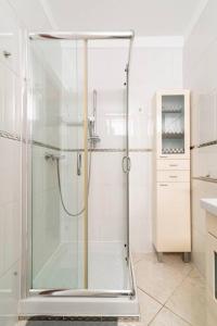 a glass shower in a bathroom with a sink at 1005 Ocean view house La cascada in Puerto Rico de Gran Canaria