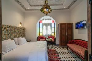 Rúm í herbergi á DARIF's Riad & Spa