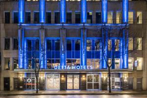 a building with blue lights on the front of it at Delta Hotels by Marriott Vancouver Downtown Suites in Vancouver