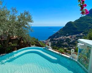 a swimming pool with a view of the ocean at Villa Graziella Positano "a Piece of Paradise" in Positano