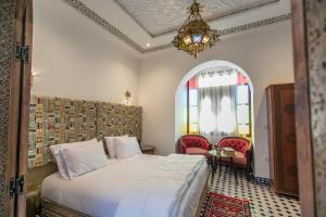Rúm í herbergi á DARIF's Riad & Spa