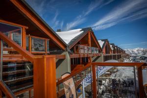 a view from a balcony of a ski lodge at HOTIDAY Chalet Sestriere Vialattea in Sestriere