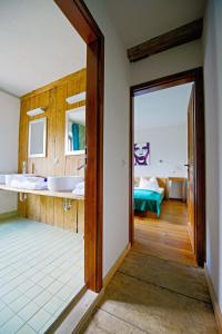 Ein Bett oder Betten in einem Zimmer der Unterkunft Mühle Tornow am Wentowsee