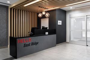 a lobby with a hello east riding sign on a counter at TownePlace Suites by Marriott Chattanooga South, East Ridge in Chattanooga +57 photos