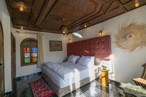 Rúm í herbergi á DARIF's Riad & Spa