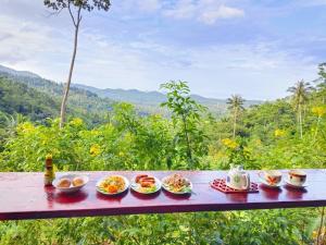 a tray of food sitting on a table with food at SZ Samui Glamping in Ban Sa Ket