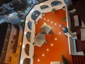 a building with umbrellas on the side of it at Hotel Monterrey in Termas de Río Hondo
