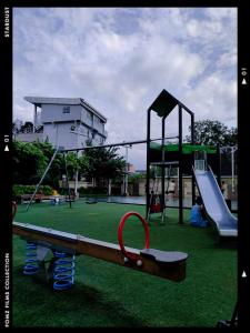 a playground with a slide and a slideintend at SERENDIPITY PLACE @CELANDINE in Manila