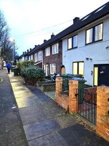 a row of houses on a street at LONDON SLEEPHOUSE in London