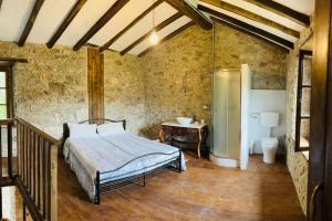 a bedroom with a bed and a sink in a room at Tuscany Escape in Borgo a Mozzano