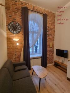 Posezení v ubytování Small Cozy two-level Apartments 9