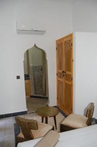 Postel nebo postele na pokoji v ubytování Riad Orient Palace