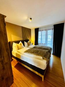 Säng eller sängar i ett rum på Chalet Swiss Alpine Haven