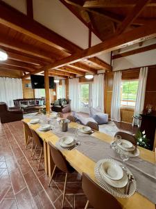 a large dining room with a long table and chairs at Haus Palazzo in Bosanska Krupa