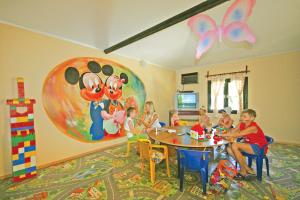 a group of children sitting at a table in a classroom at Hotel Aqua in Marmaris