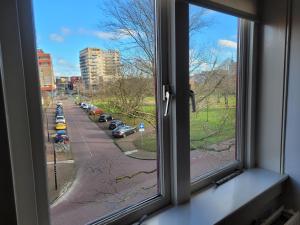 a window with a view of a street at BakeryInn Amersfoort in Amersfoort