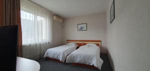 Postel nebo postele na pokoji v ubytování Motel Monza