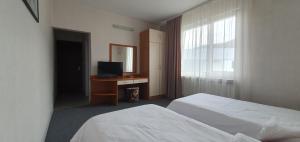 Postel nebo postele na pokoji v ubytování Motel Monza