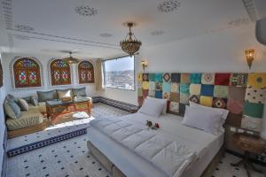Rúm í herbergi á DARIF's Riad & Spa