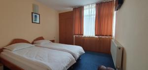 Postel nebo postele na pokoji v ubytování Motel Monza
