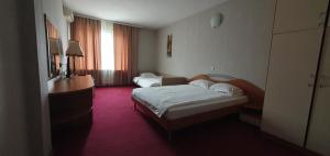 Postel nebo postele na pokoji v ubytování Motel Monza