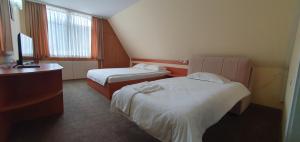 Postel nebo postele na pokoji v ubytování Motel Monza