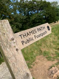a sign that says thames park public footprints at Thames Head Wharf - Historic Cotswold Cottage with Stunning Countryside Views in Cirencester