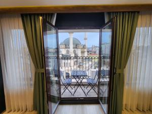 a balcony with a view of a building at Taksim Landhouse Hotel 1 Min to Taksim Square in Istanbul