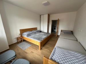 Posteľ alebo postele v izbe v ubytovaní Vila Kosmonautka