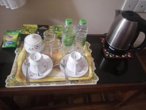 a tea set on a tray on a table at Shalom in Peradeniya