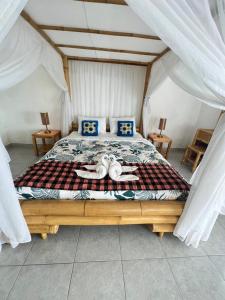 Giường trong phòng chung tại Bukit Luah Sidemen