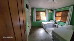 En eller flere senge i et værelse på Casa Martins