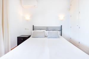 Posteľ alebo postele v izbe v ubytovaní Casa Pamela