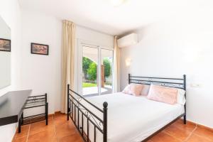 Posteľ alebo postele v izbe v ubytovaní Casa Pamela