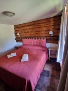 Giường trong phòng chung tại Cabañas La Señalada