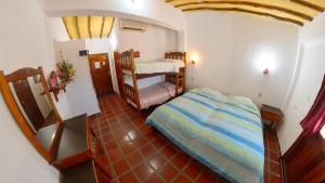 a room with two bunk beds in a room at Posada Las Ross in La Mira