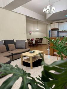 a living room with a couch and a table at Riverview Home @Waterfront KCH in Kuching