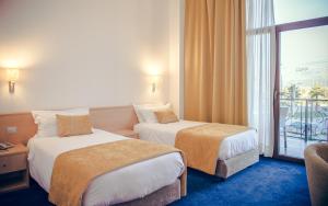 Postel nebo postele na pokoji v ubytování Hotel Airport Tirana
