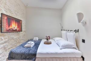 En eller flere senge i et værelse på Cozy apartment - 1BR 4P - Grenelle Eiffel tower