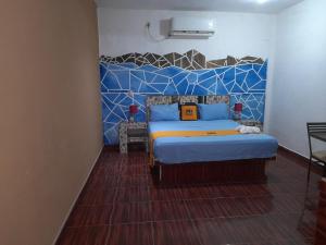Postel nebo postele na pokoji v ubytování Mi Hotel Club