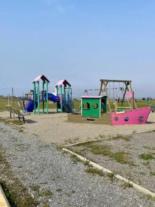 a row of playground equipment in a park at Chalet Pakingan in Cap-Chat