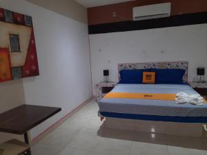 Postel nebo postele na pokoji v ubytování Mi Hotel Club