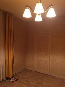 an empty room with two lights and a door at Chambre cosy de Bonabry in Fougères