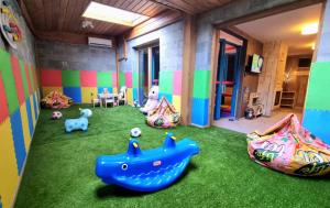 a room with some toys on the grass at BOUTIQUE Hotel ENTRY E in Bansko