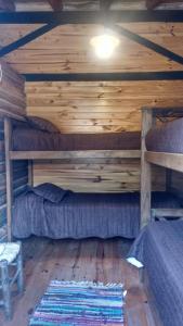 a room with two bunk beds in a cabin at Balcones del Portezuelo in Potrerillos