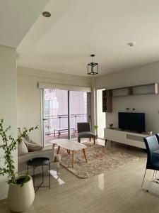 Et opholdsområde på DEPARTAMENTO CENTRICO DE LUJO CON PISCINA Y COCHERA