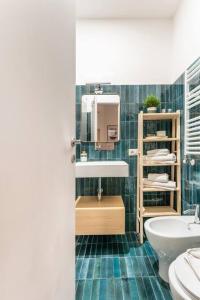 a bathroom with a sink and a toilet at Modern Loft Trastevere in Rome