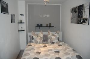 a bedroom with a bed with pillows on it at Appartement Brinkmann in Braunlage